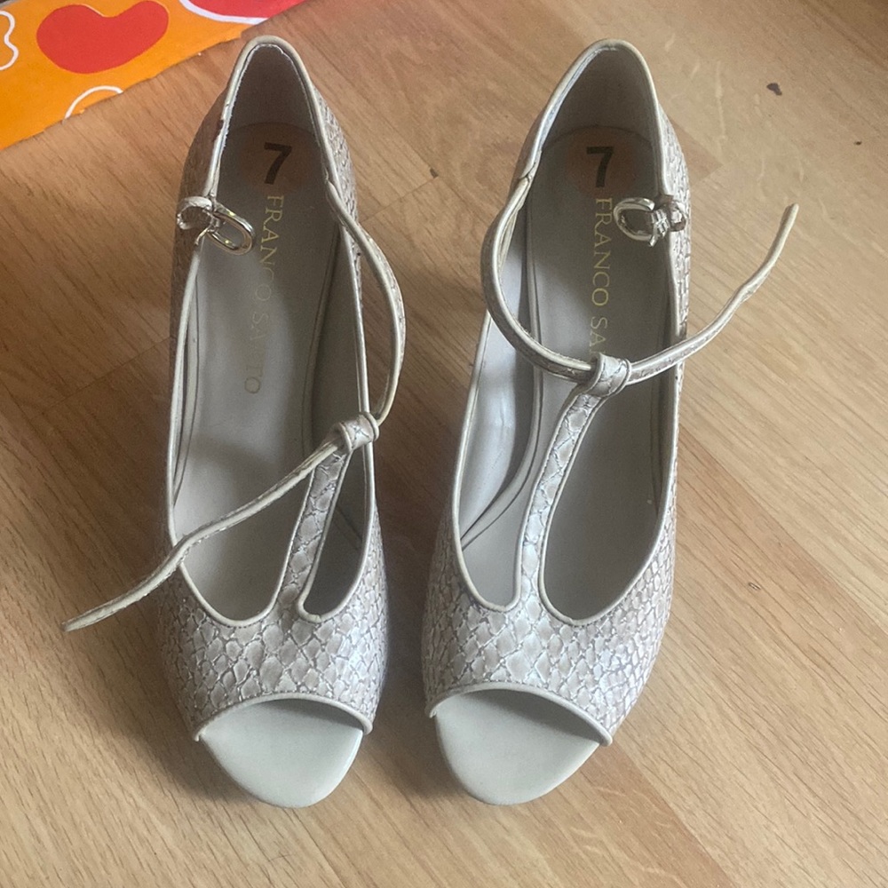 These are beige Franco Sarto heels size 7.